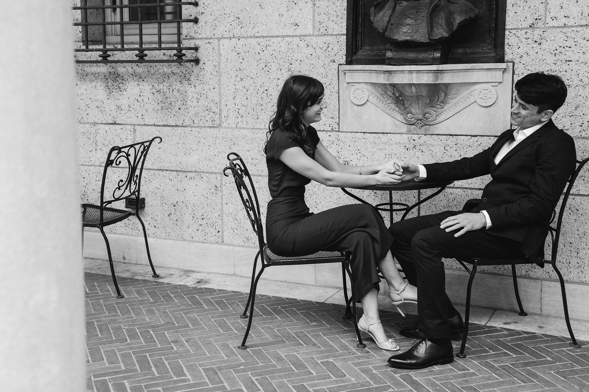 A documentary photograph of a couple sitting together in the Boston Public library