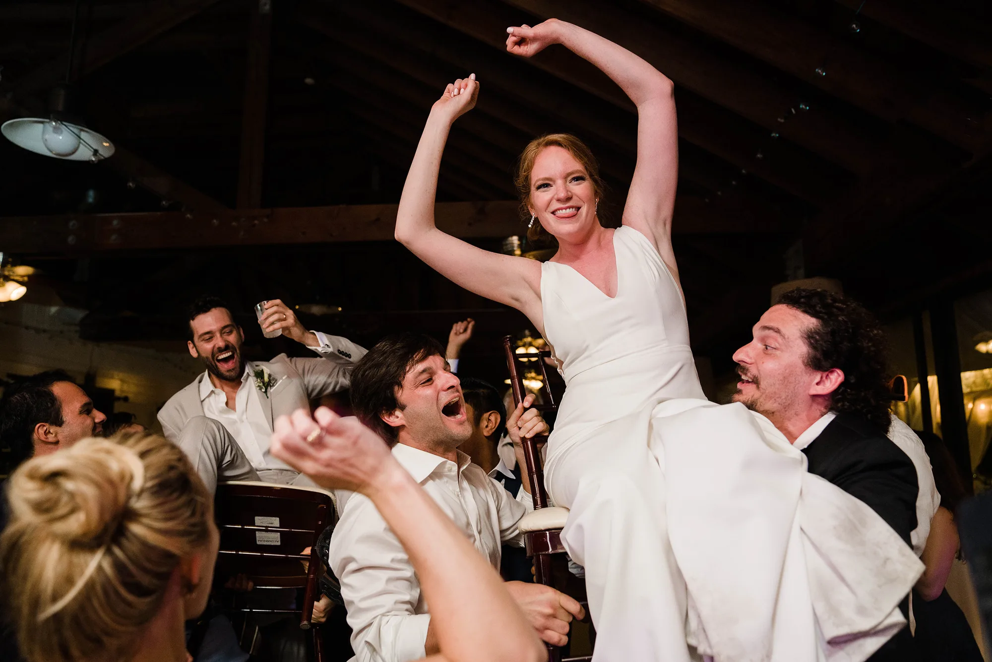 A documentary photograph featured in the best of wedding photography of 2019 showing a bride and groom dancing to the hora.