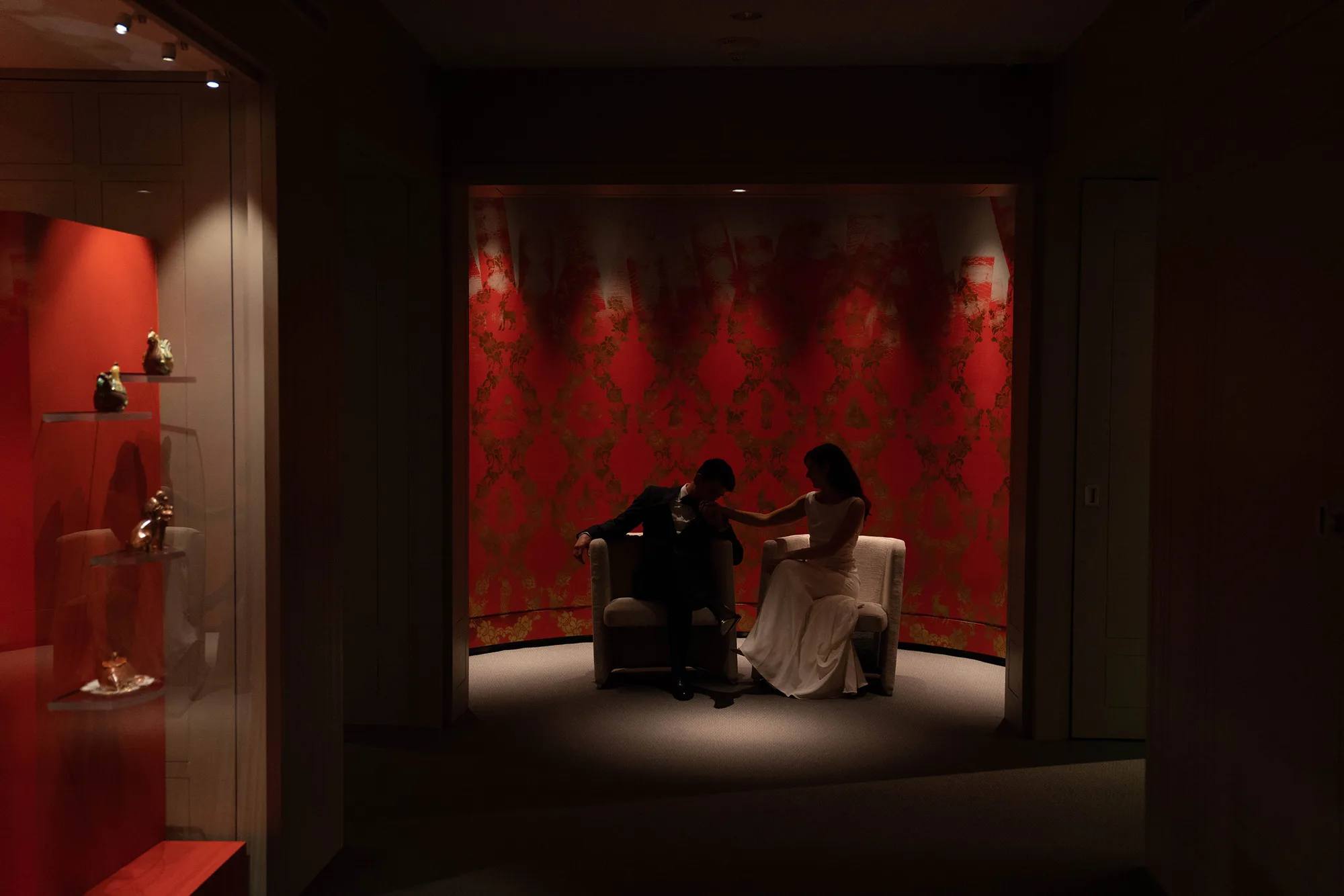 A documentary photograph featured in the best of wedding photography of 2019 showing a bride and groom sharing an intimate moment at the Peabody Essex Museum
