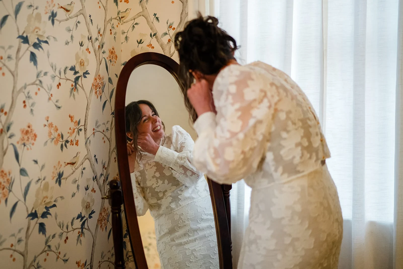 A documentary photograph of a bride getting ready during her Loring Greenough House Wedding.