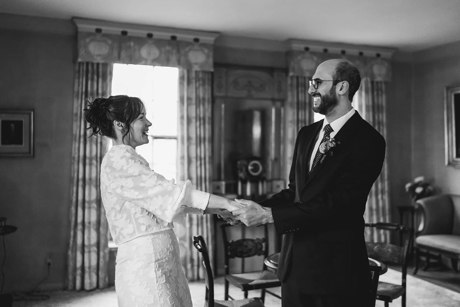A documentary photograph of a bride and groom seeing each other before their Loring Greenough House Wedding.