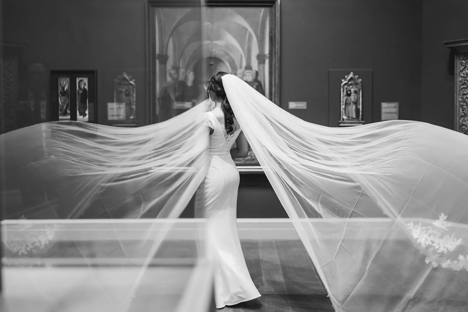 A documentary and artistic photograph of a bride in the art galleries during her intimate Worcester Art Museum Wedding