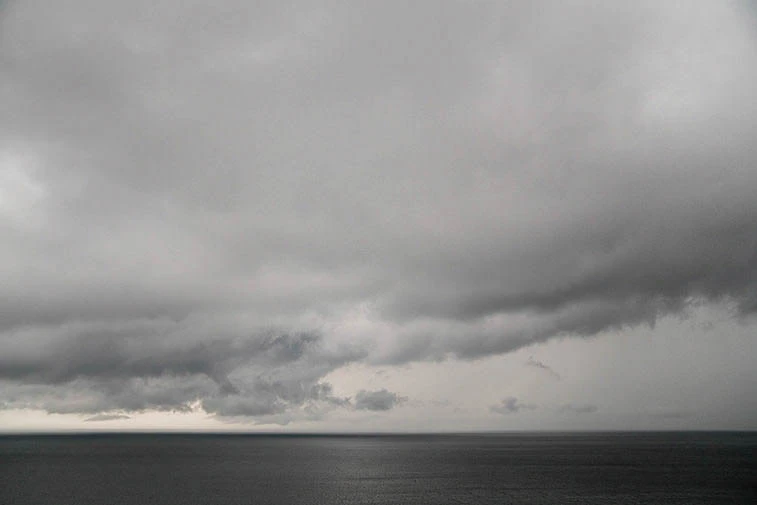 A stormy sky over a calm sea