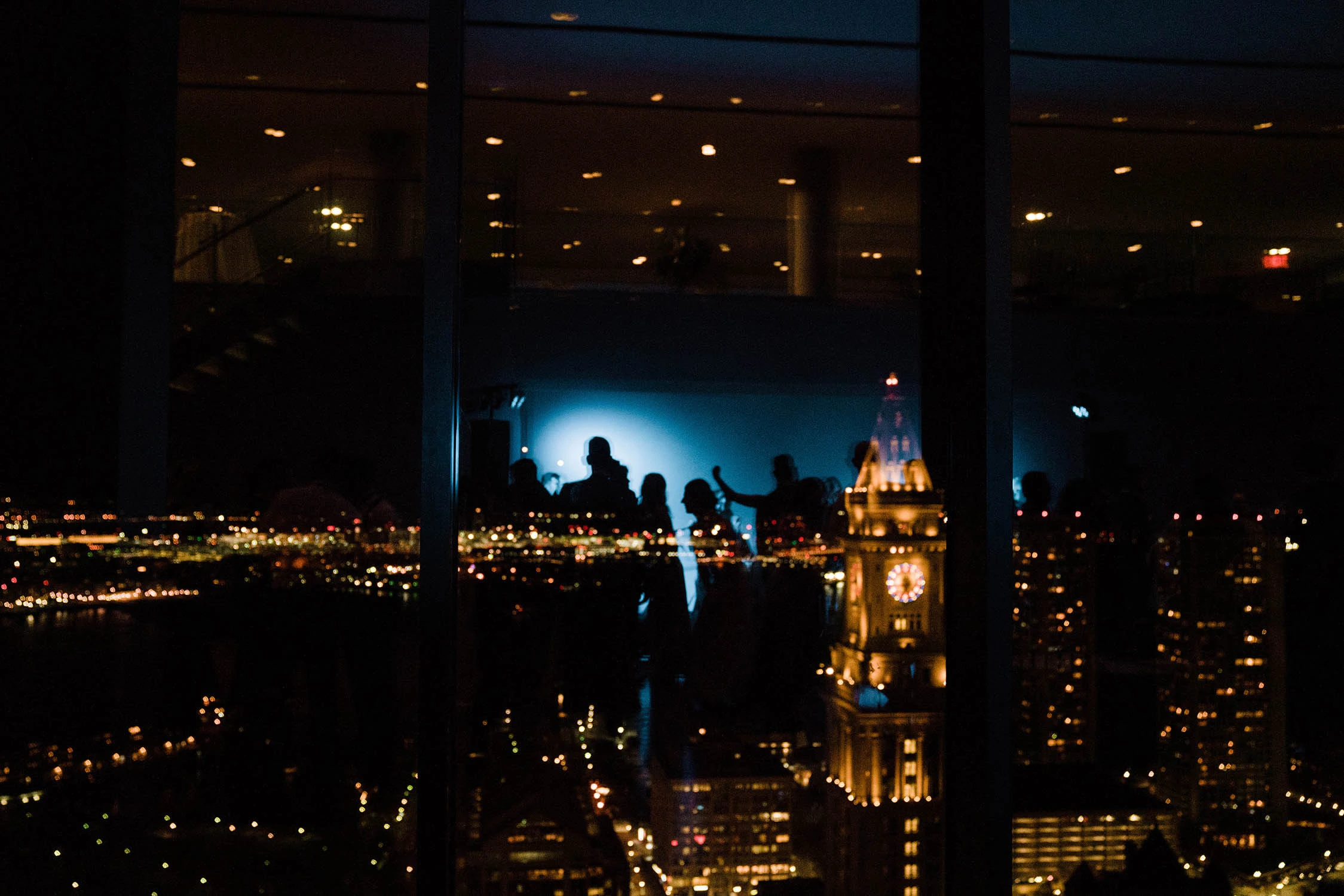 The city at night from a high window, the clock tower lit