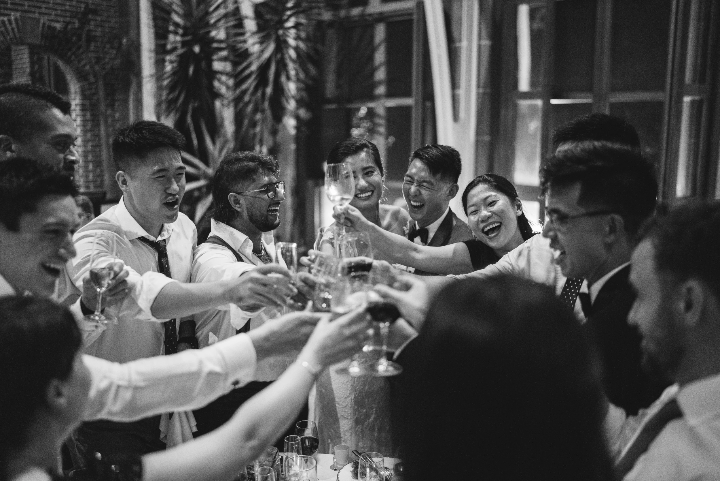 Guests raising their glasses in a toast