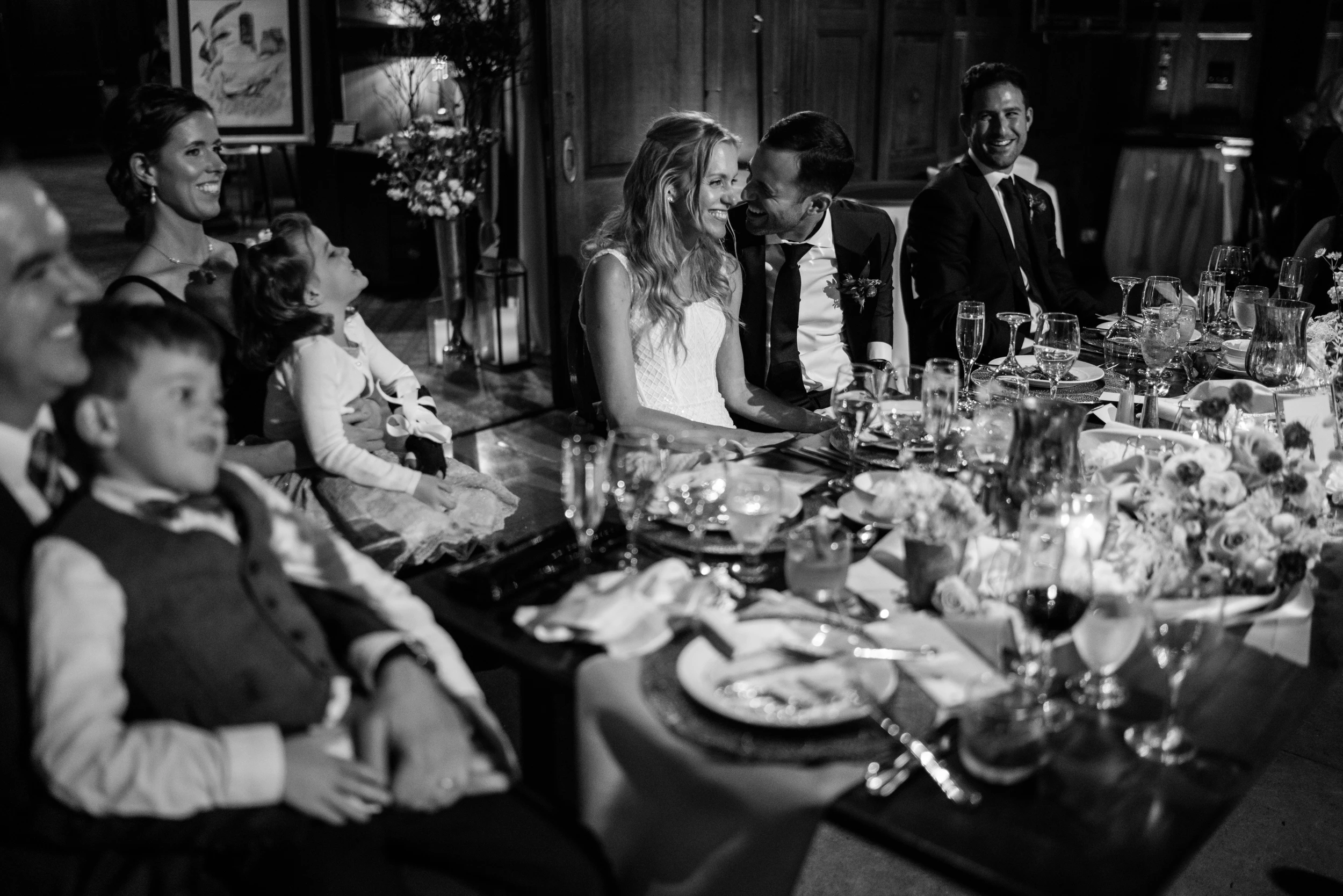 Children and guests around a long dinner table