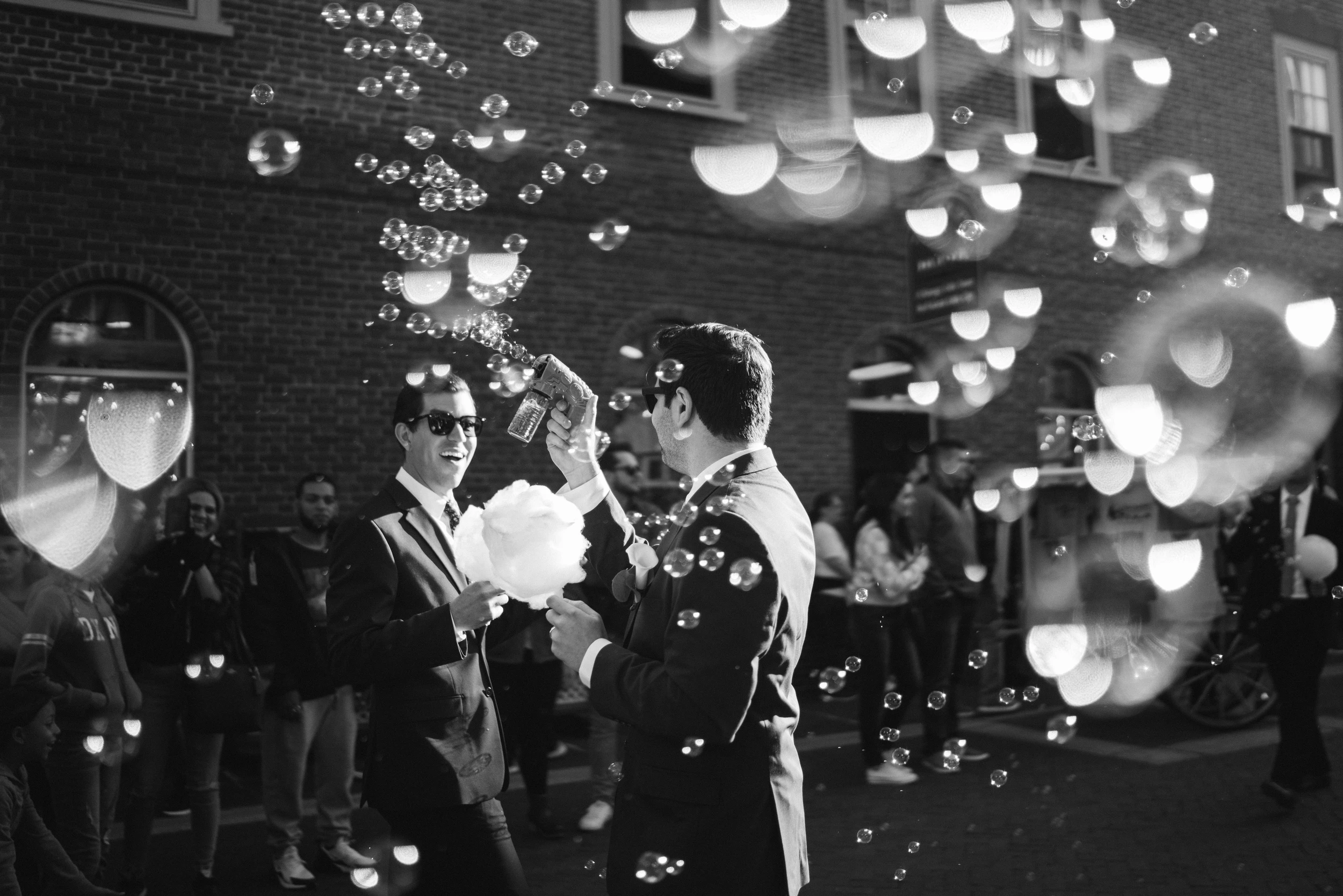 Guests in uniform under a cloud of bubbles