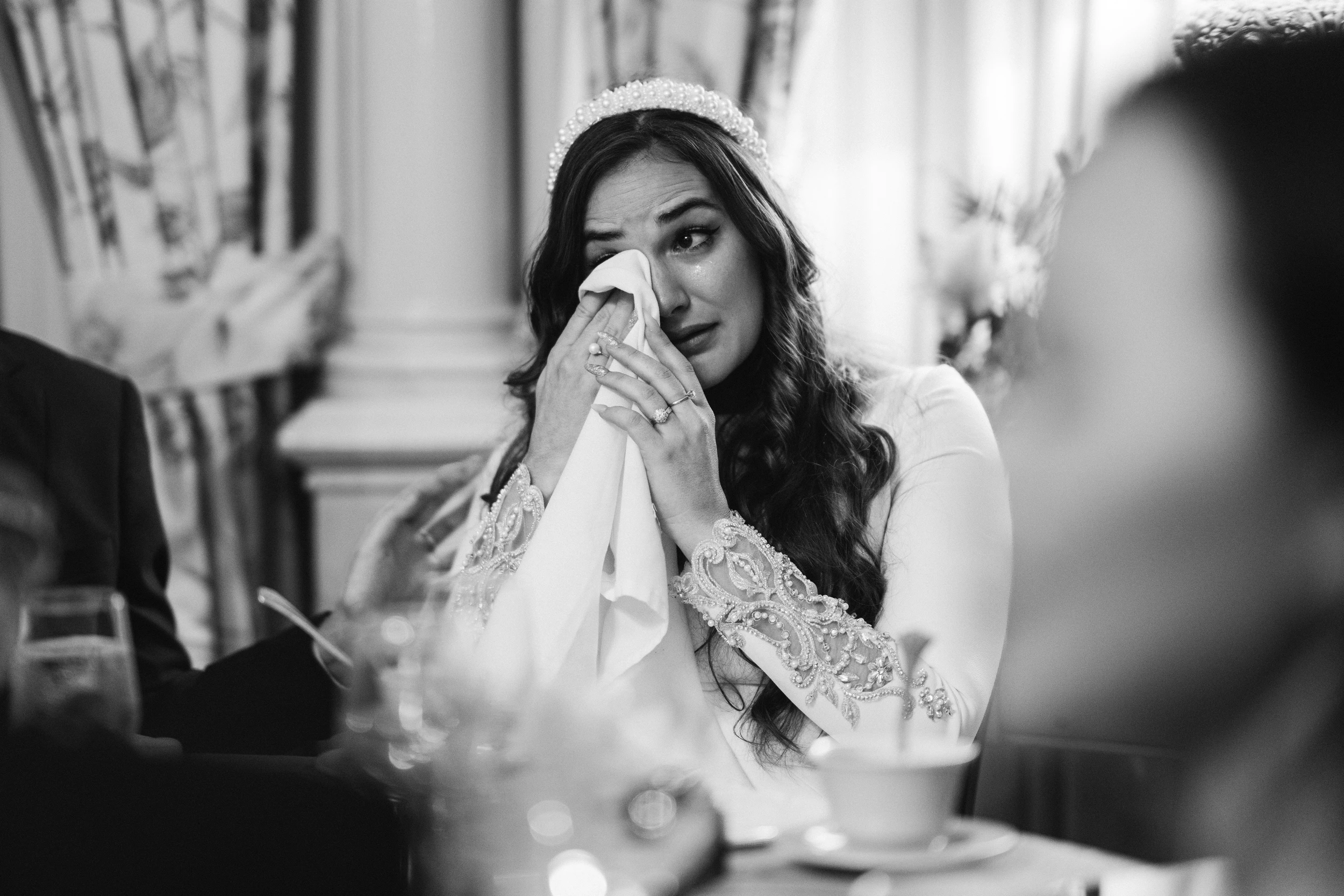 The bride wiping away a tear